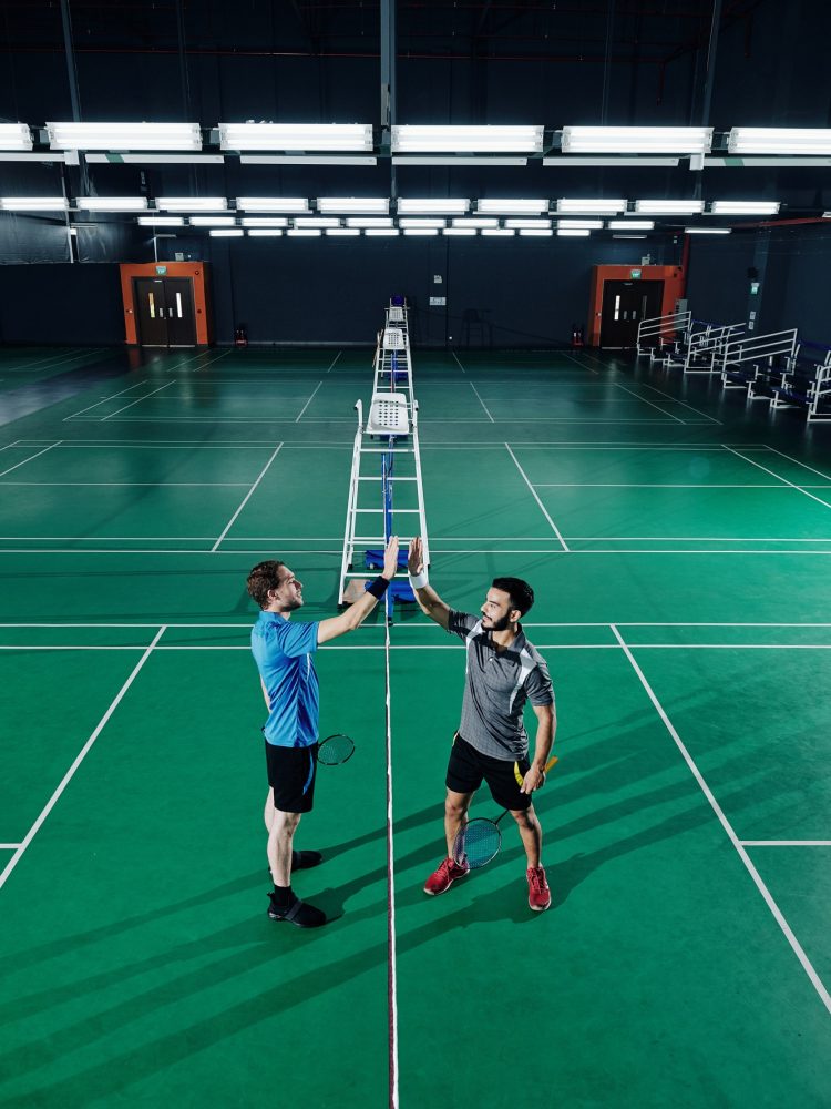 Badminton players giving hign five